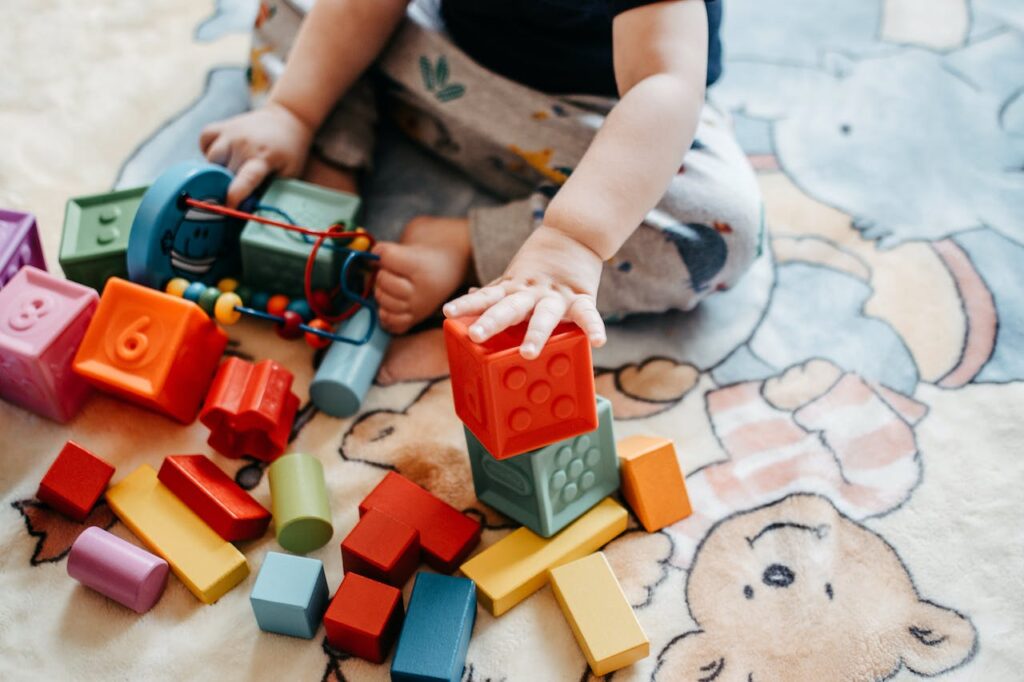 Infant using sensory-motor skills to learn